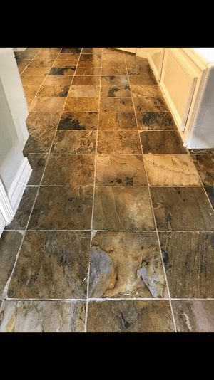 A close up of a tiled floor in a kitchen.