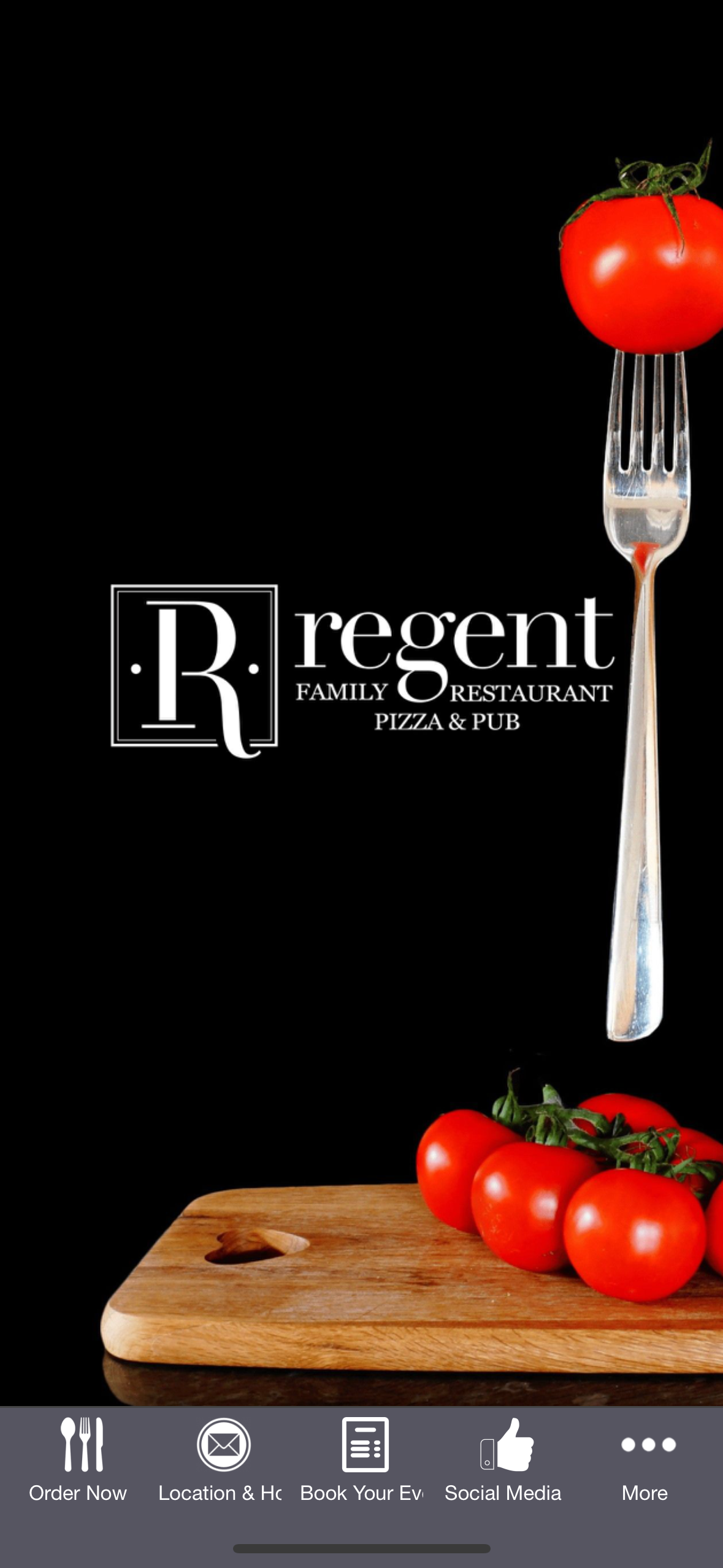 A fork is hanging from a tomato on a cutting board.