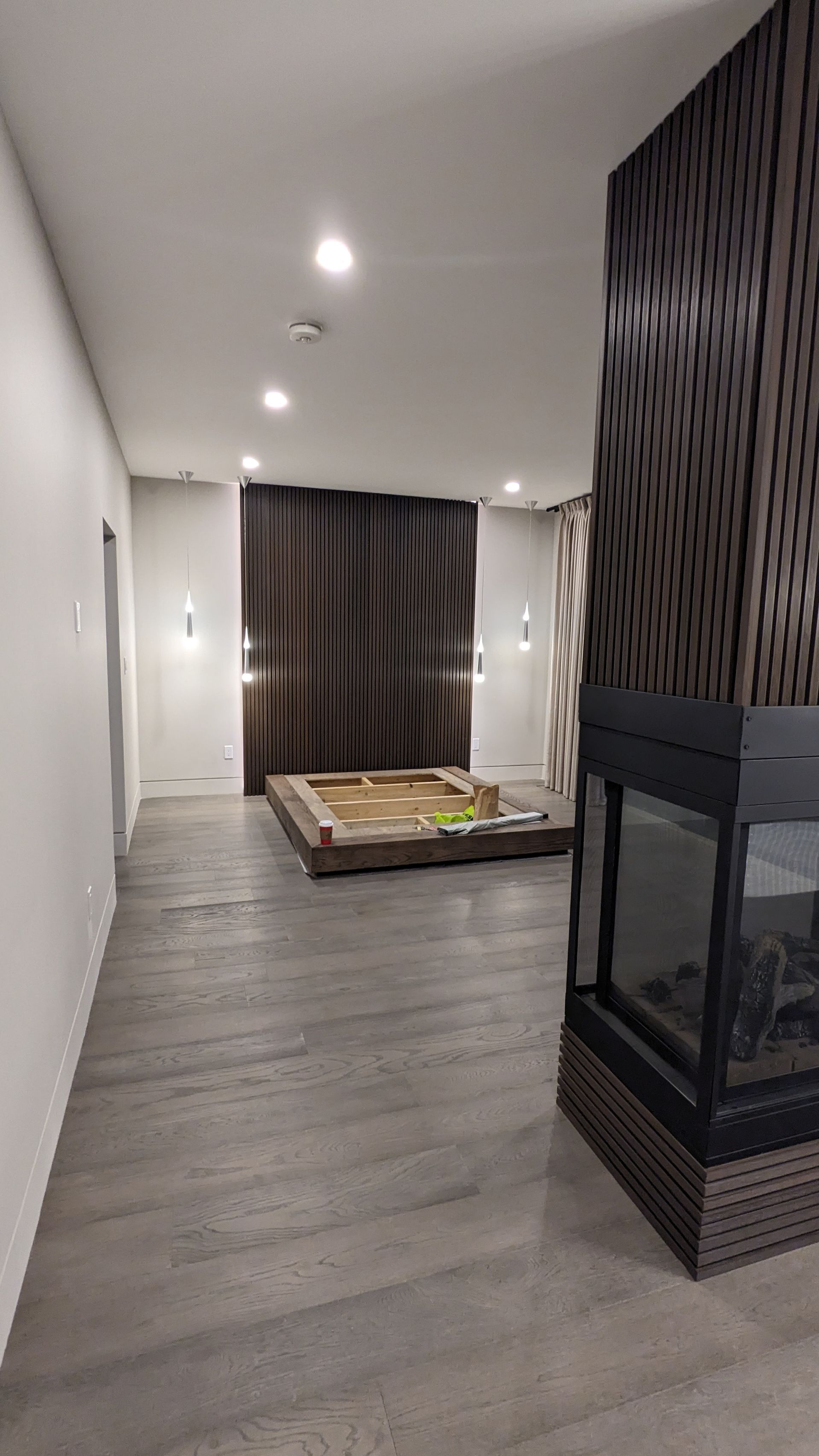 There is a fireplace in the middle of the room.