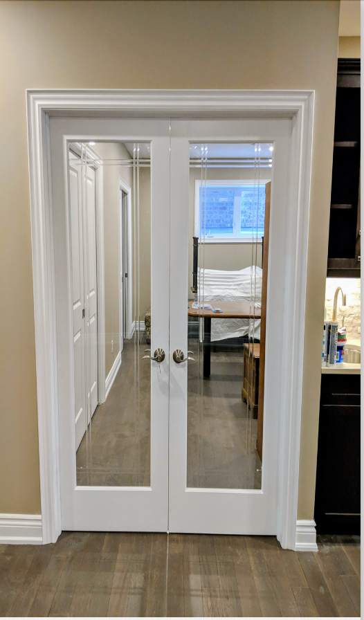 A living room with a couch , coffee table , and stairs.