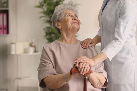 caregiver with an old woman