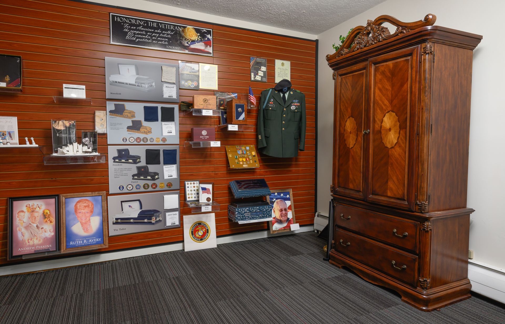 Living room with floral sofas, round coffee table, and large television.