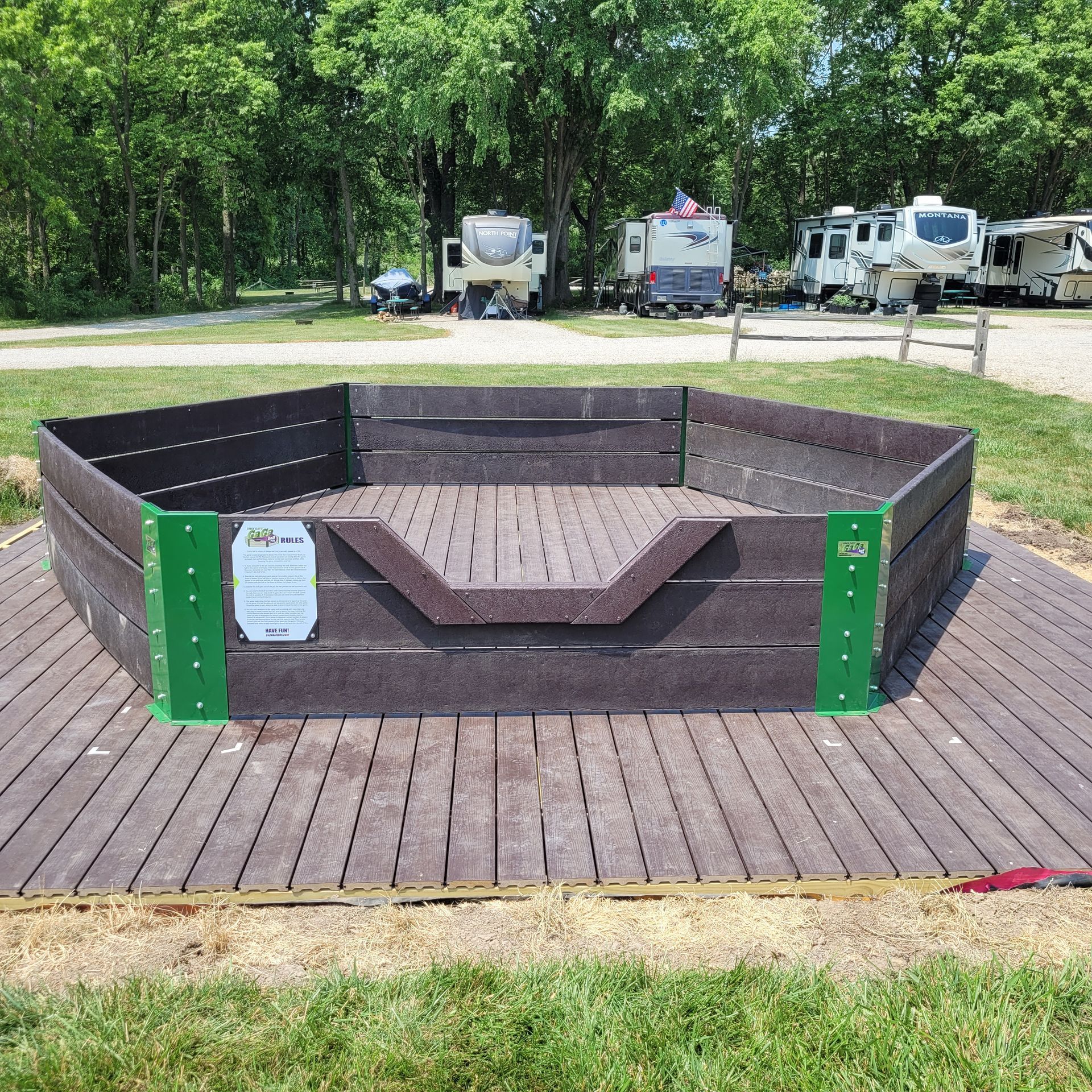 A wooden deck with a sign that says no dogs on it