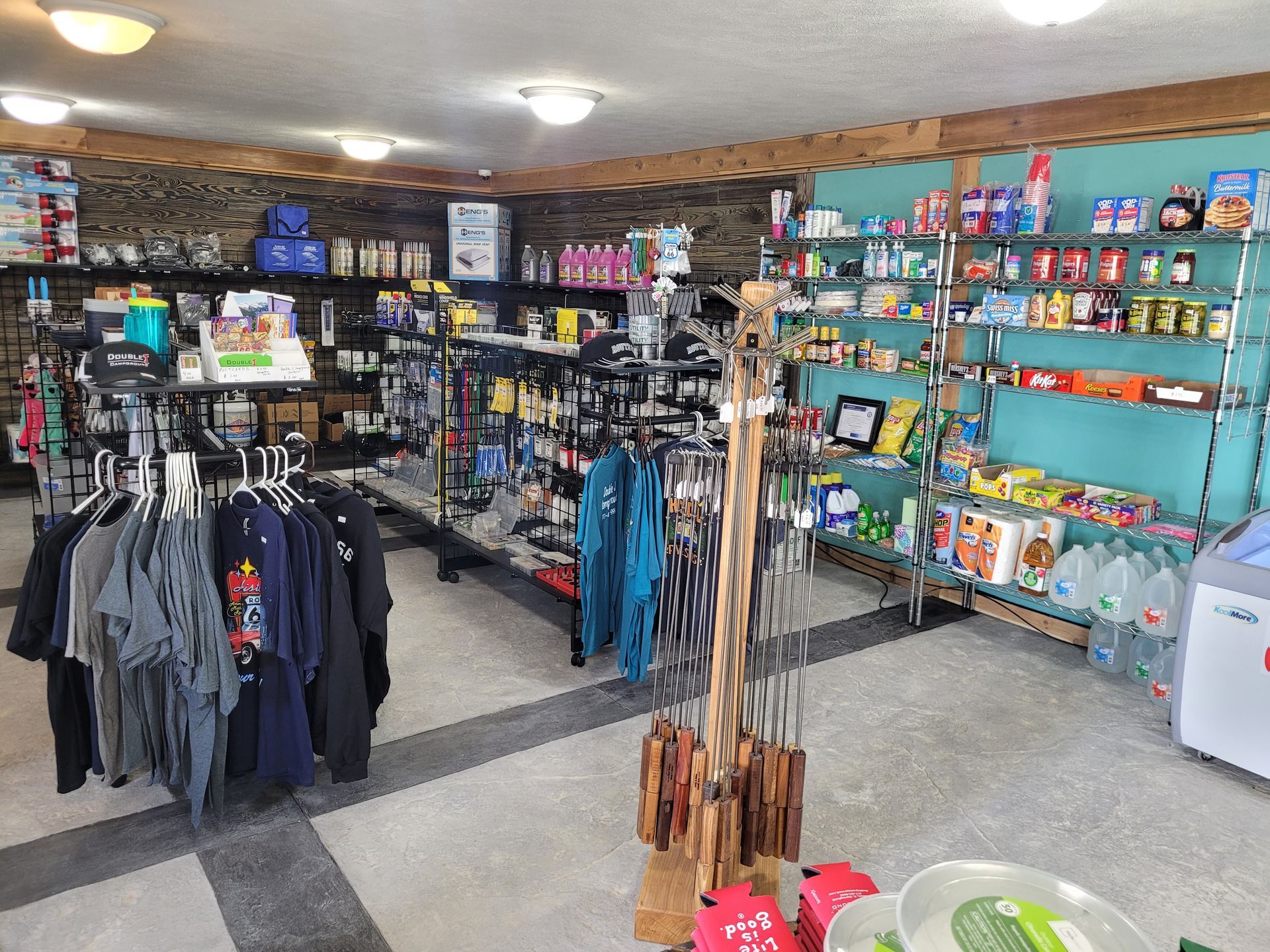 A store filled with lots of clothes and groceries.