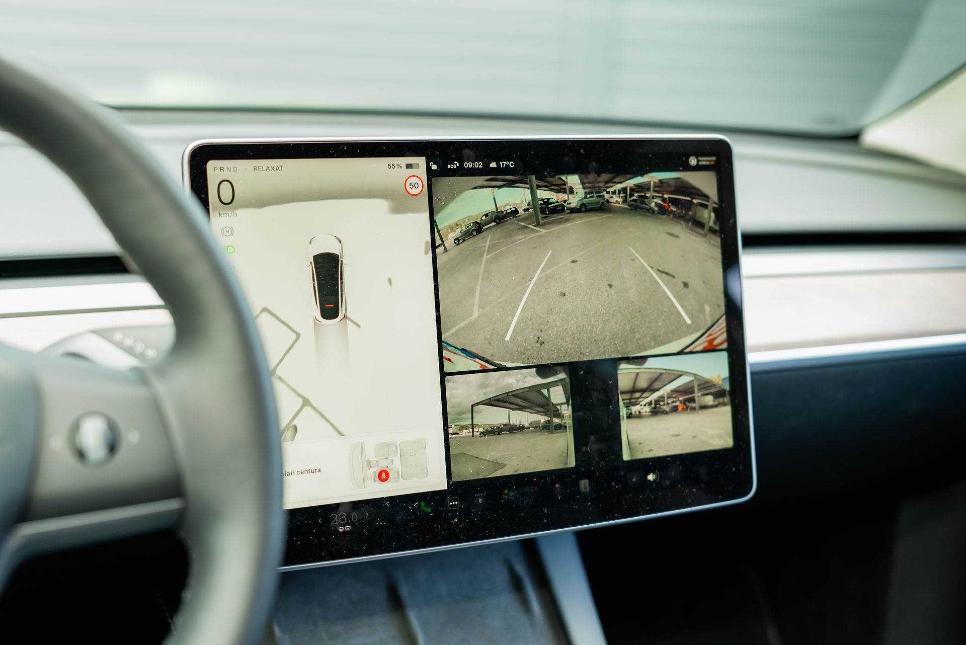 Car's dashboard screen displaying a top-down vehicle view