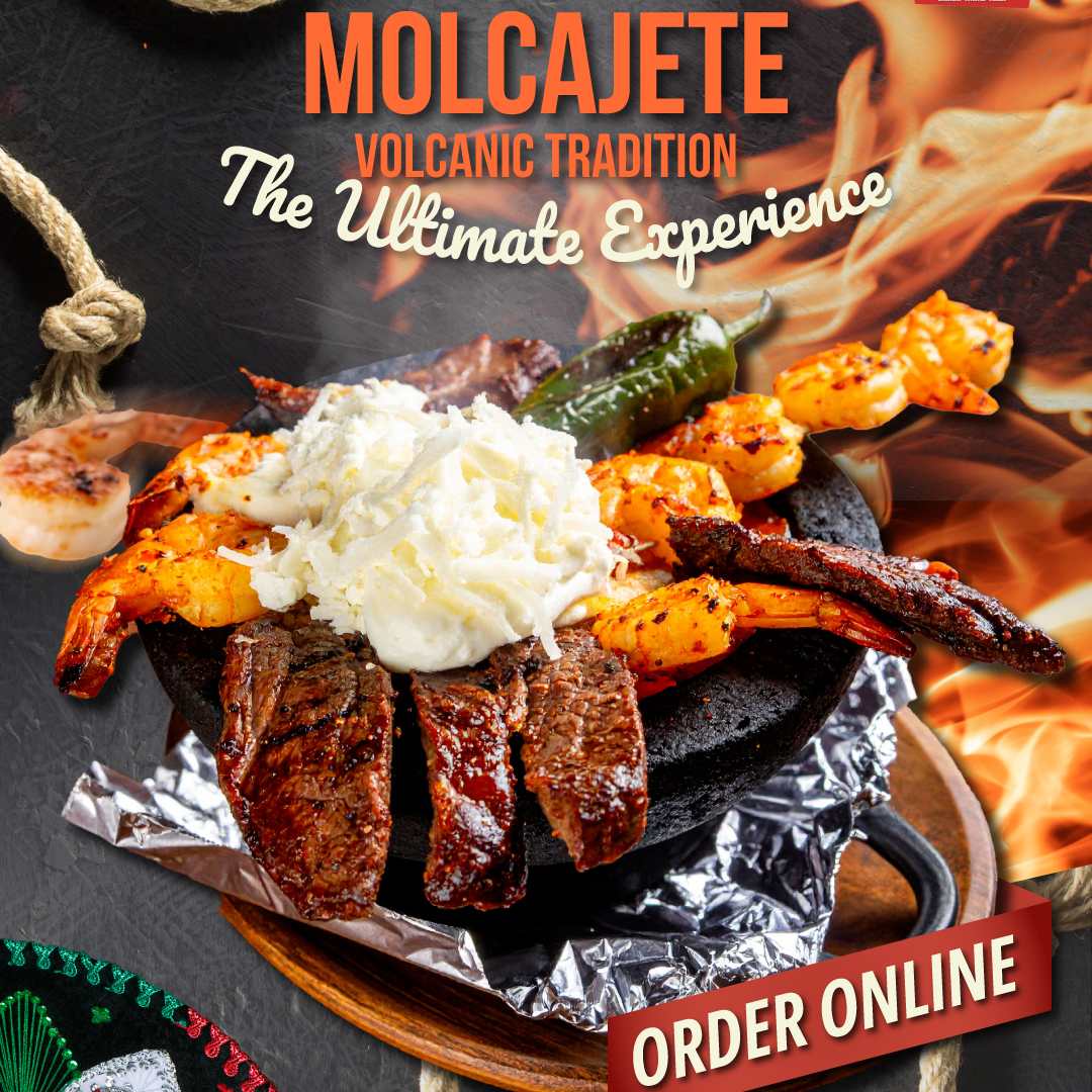 Molcajete dish with shrimp, steak, cheese, and a pepper, displayed with flames. 