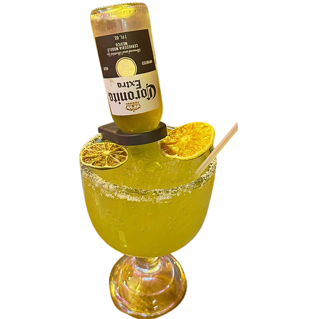 Margarita cocktail with a Corona bottle, lime, and orange slices.