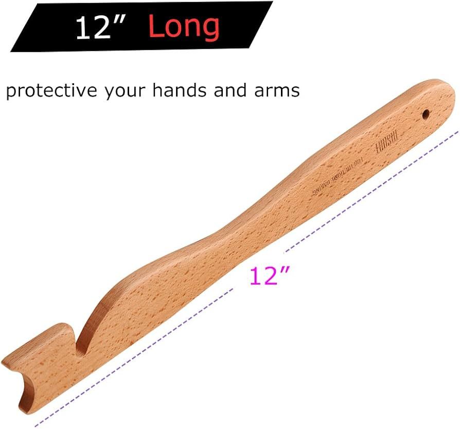 Wooden tool with a long handle and curved end, labeled 