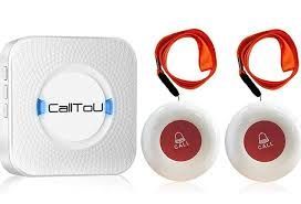 Wireless emergency call button system; a white receiver with two pendant buttons, each with a red 