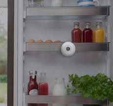 Refrigerator interior with food and white sensor.