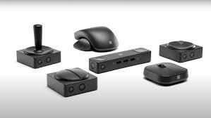 Black accessibility computer input devices, including a joystick, mouse, and trackball.