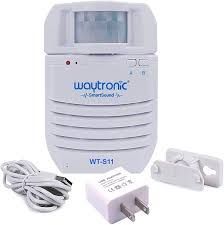 White Waytronic motion sensor, power adapter, USB cable, and mounting brackets.