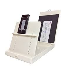 White desk organizer holding a smartphone and a document.