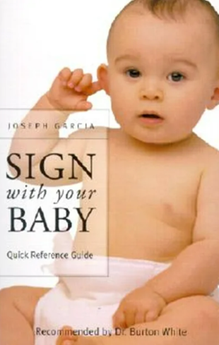 Book cover: Baby pointing at ear, title 
