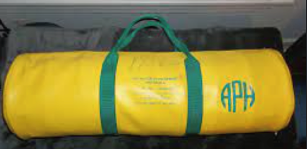 Yellow duffel bag with green straps and 