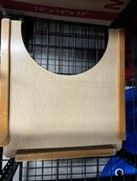 Wooden footrest with curved top, beige center, and brown frame.