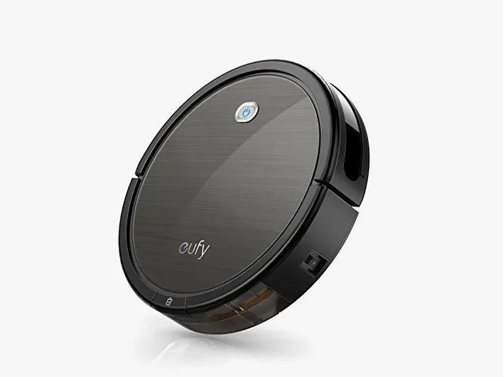 Black Eufy robotic vacuum cleaner angled on a white background.