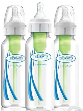 Three Dr. Brown's baby bottles with green vent inserts and white nipples, clear glass, blue and white accents.