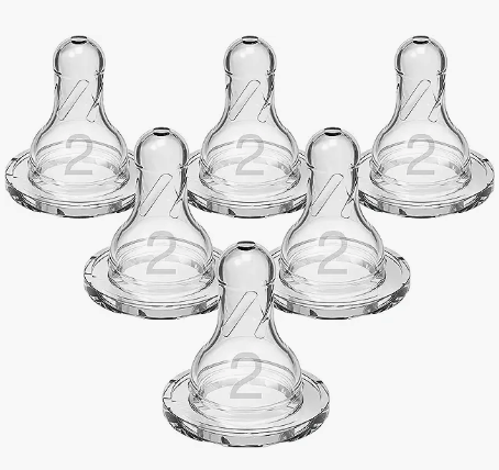 Six clear baby bottle nipples, each marked with a 