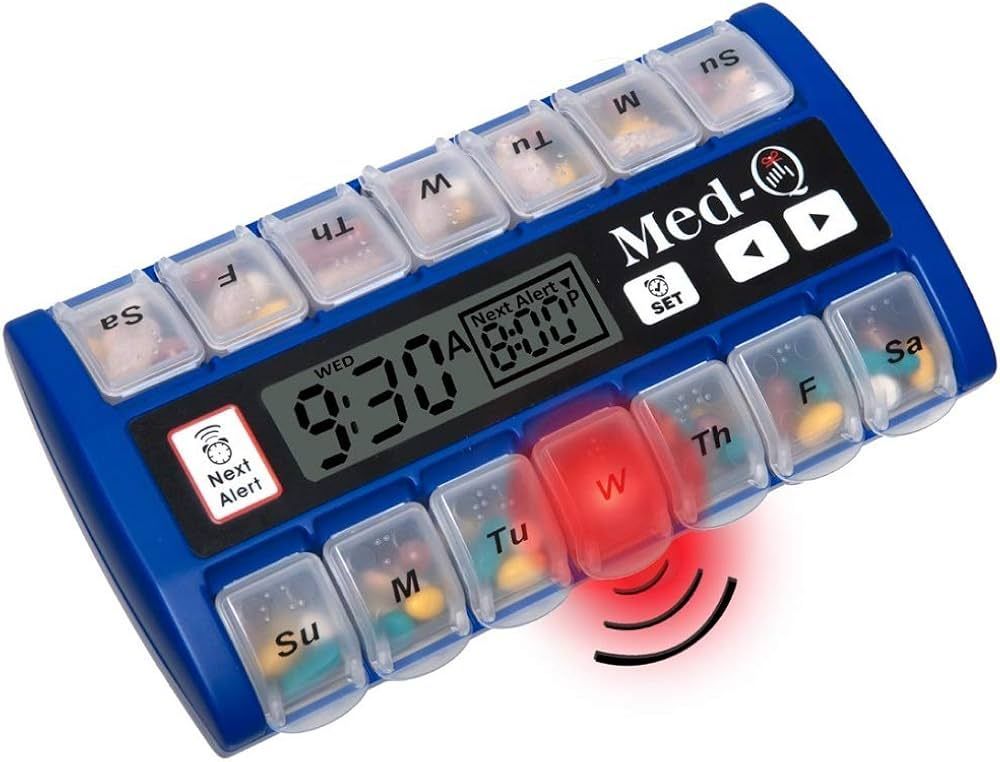 Blue pill organizer with digital clock, compartments for each day, and a flashing red light on Wednesday.