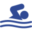 Blue swimmer in water, arms outstretched.