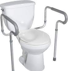 White toilet with raised seat and support arms.