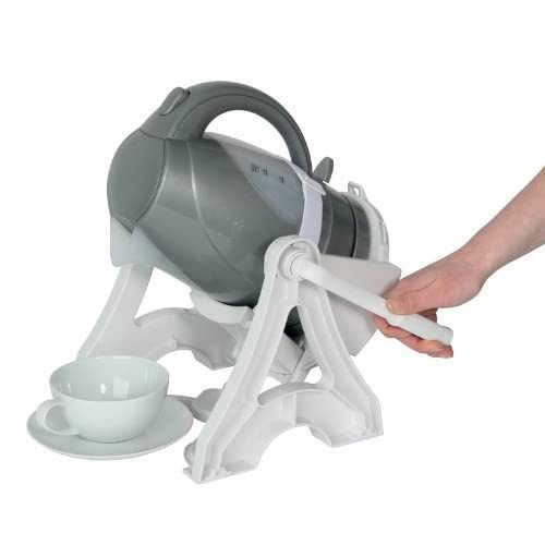 Person pours from a gray kettle held in a white tilting stand into a teacup.