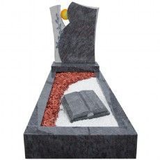 Ein Grabstein mit einem Buch darauf.