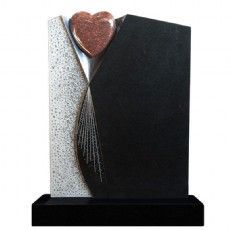 Ein schwarz-weißer Grabstein mit einem Herz darauf.