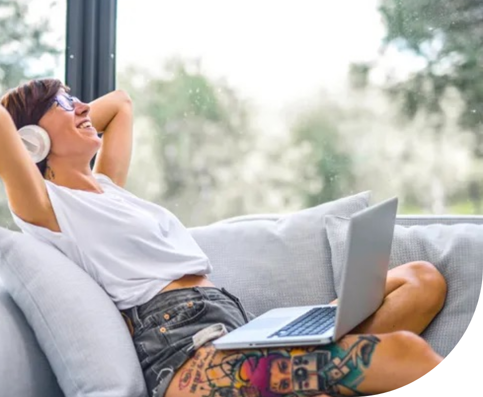 A woman lounging on a couch calmly. 