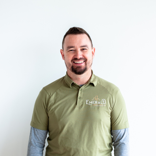 Dennis O'Sullivan, wearing a green polo shirt with 