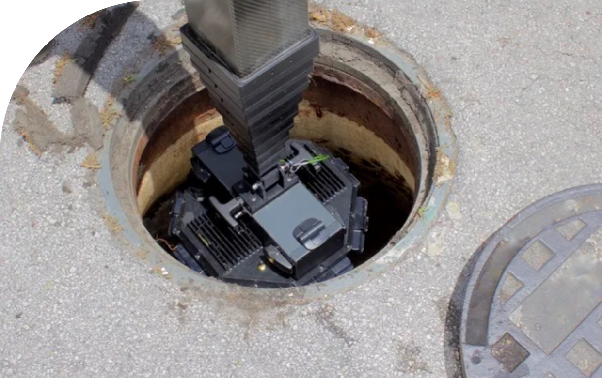 A sewer scope is being put into the ground to test it. 