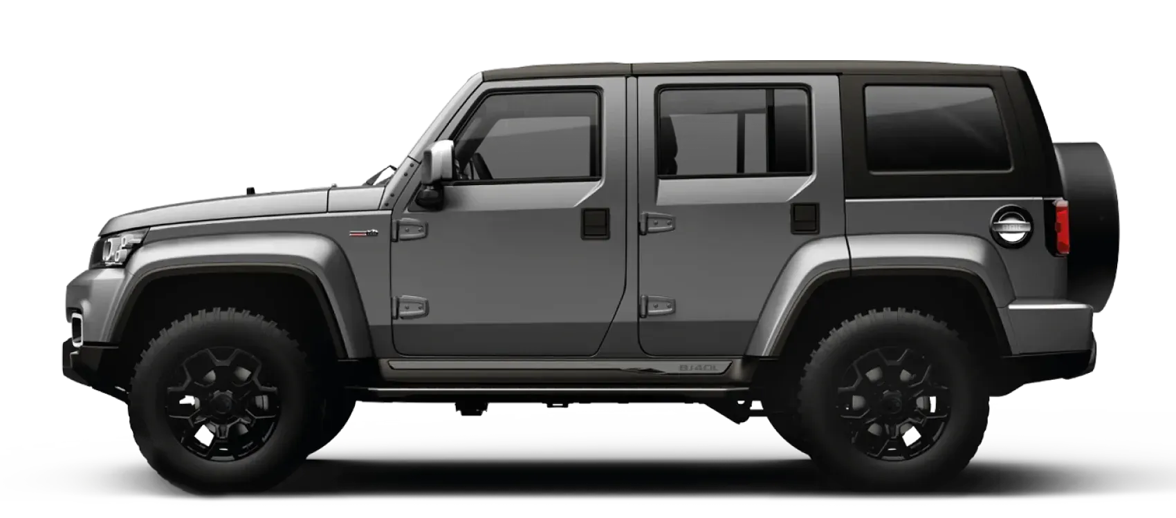 SUV gris con ruedas negras y rueda de repuesto en la parte trasera.