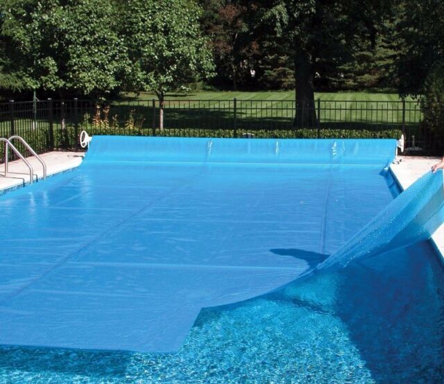 A Swimming Pool With A Blue Cover On It — Landsborough Pool Supplies & Service in Landsborough, QLD