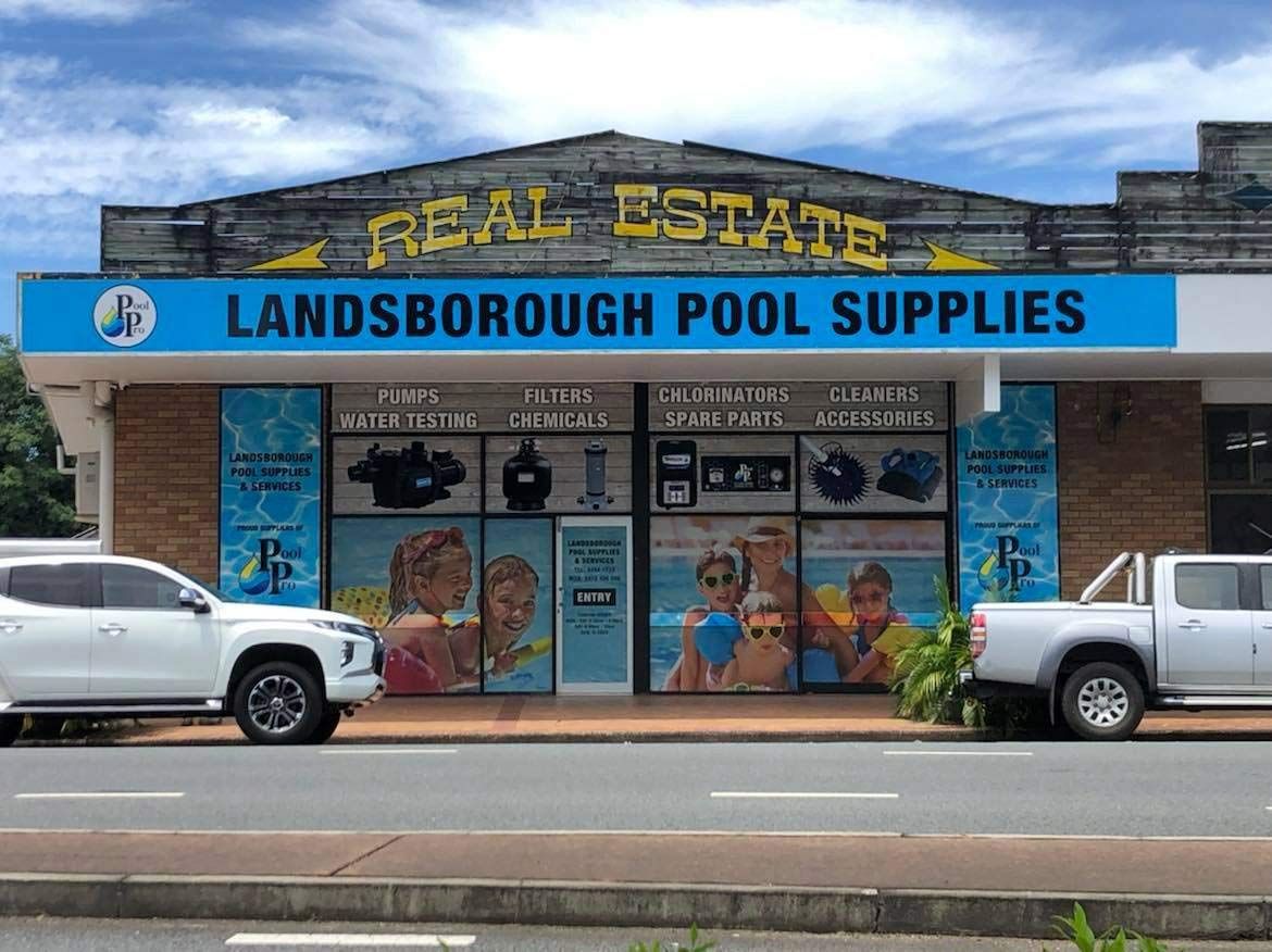White Trucks Are Parked In Front Of Pool Supplies Store — Landsborough Pool Supplies & Service in Landsborough, QLD