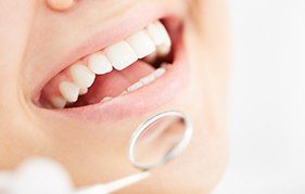 Dentist providing dental services for a child in New Plymouth