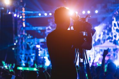 man filming the concert