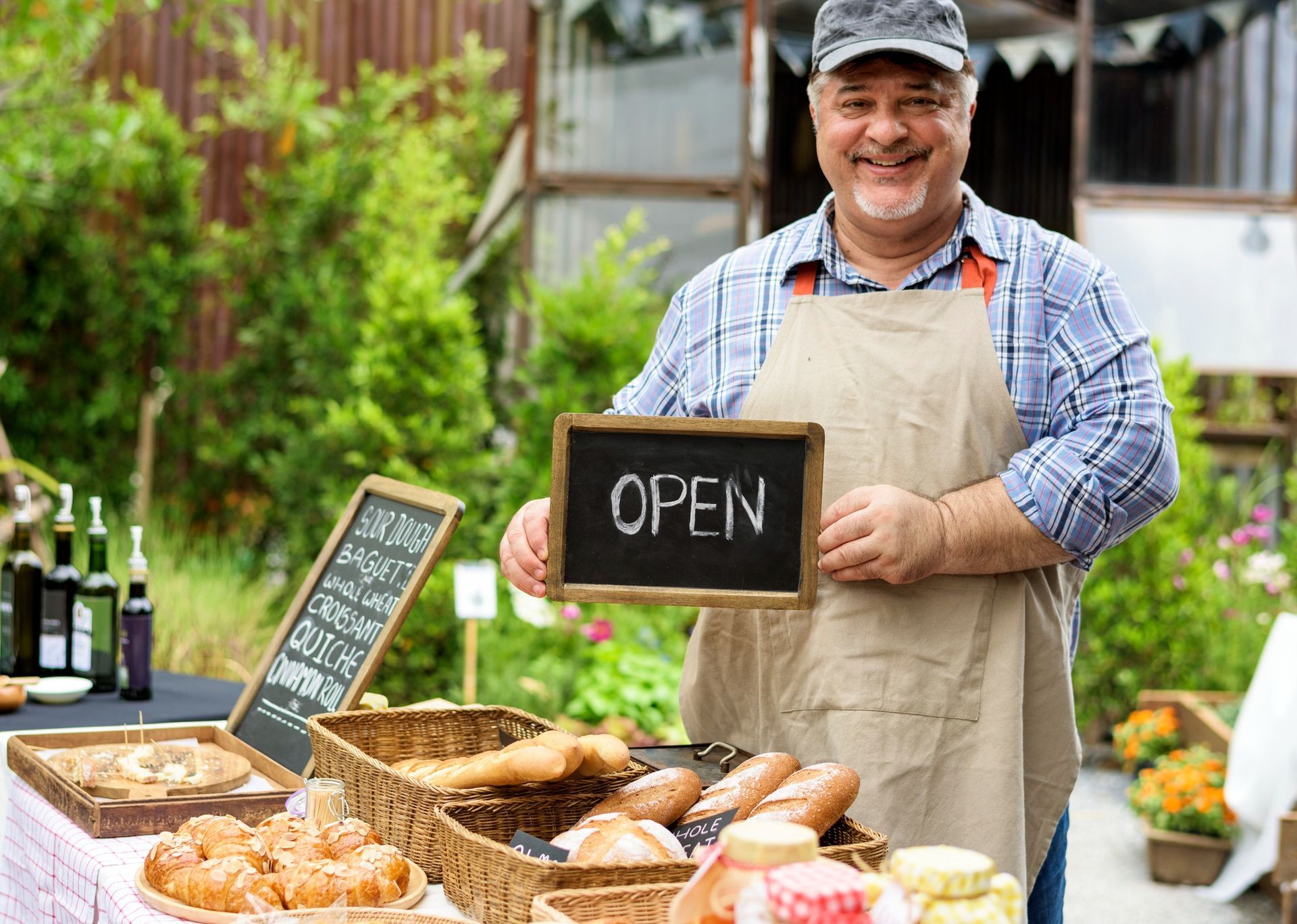 A family is posing for a picture in front of their new home.
