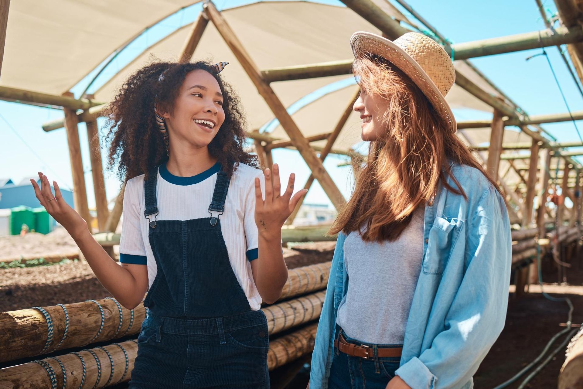 A family is laying on the grass in front of their house.