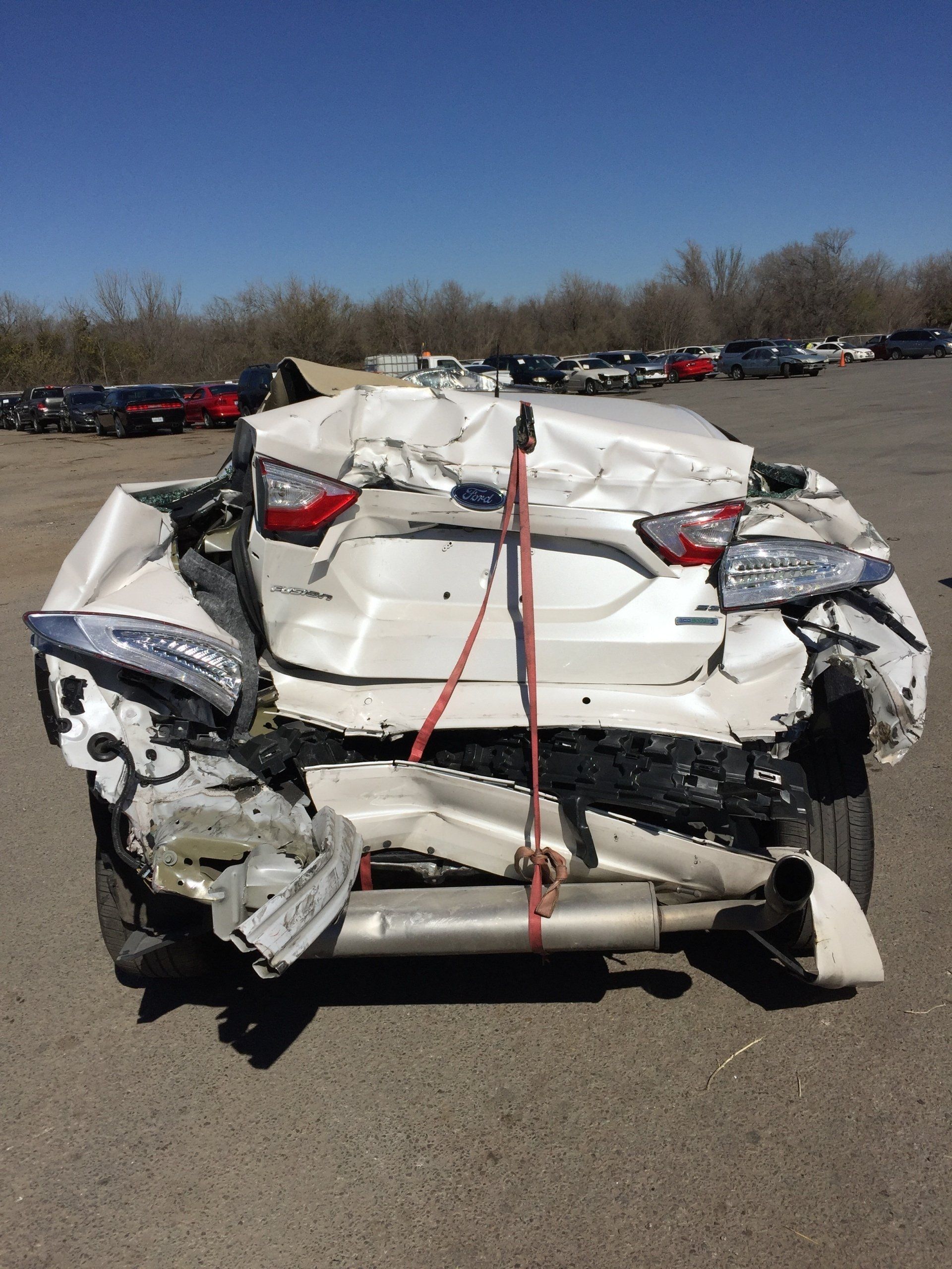 A white car that has been damaged in an accident