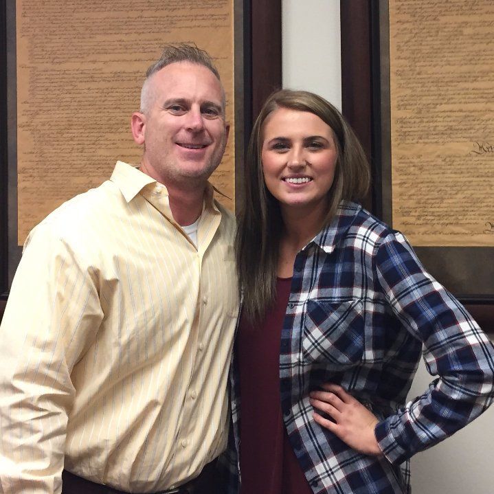 A man and a woman are posing for a picture