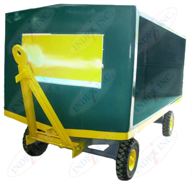 A green cart with yellow wheels and a yellow sign that says india inc.