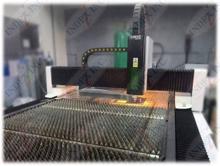 A machine that is cutting a piece of metal