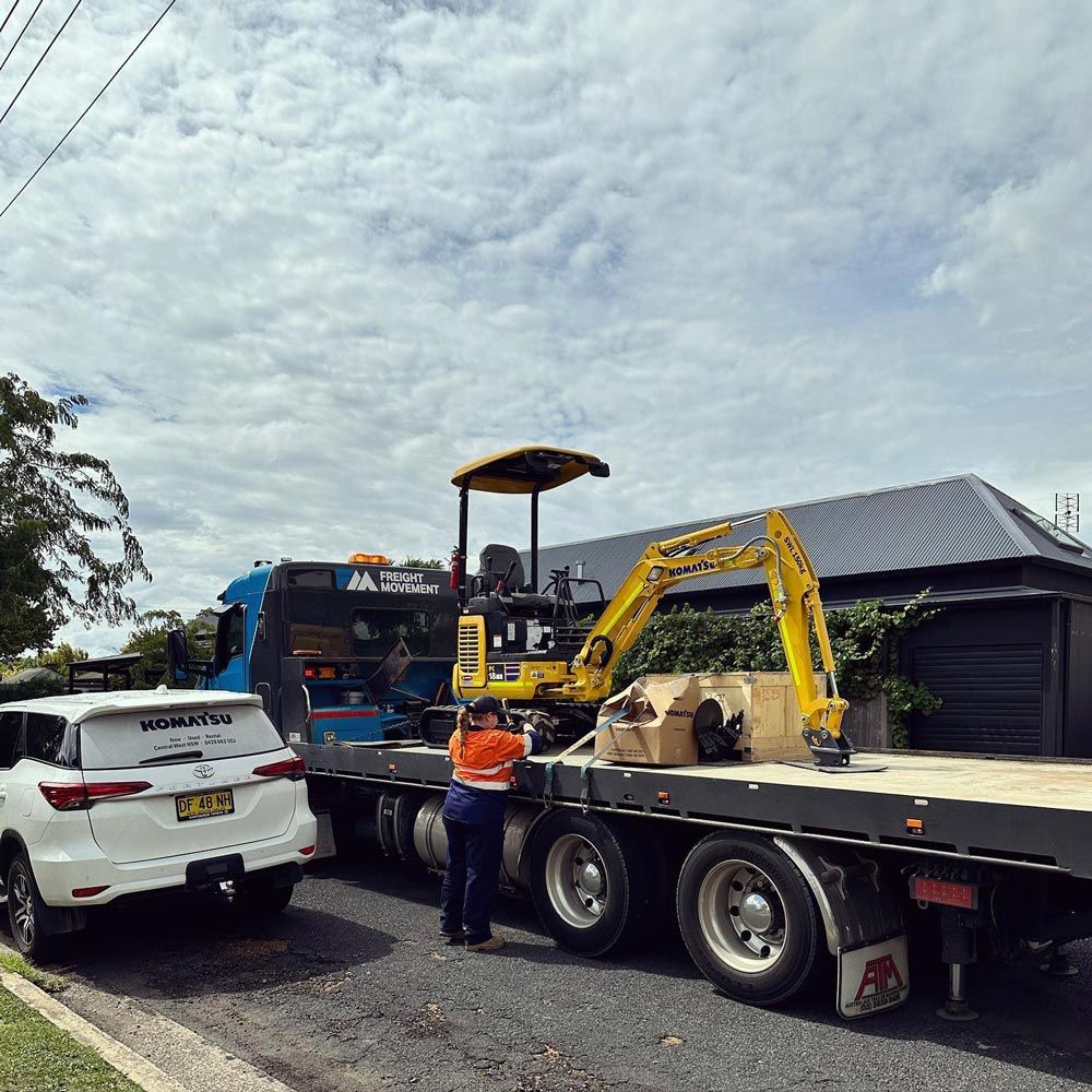 Excavator On Truck — Regional Concreting Solutions In Orange, NSW