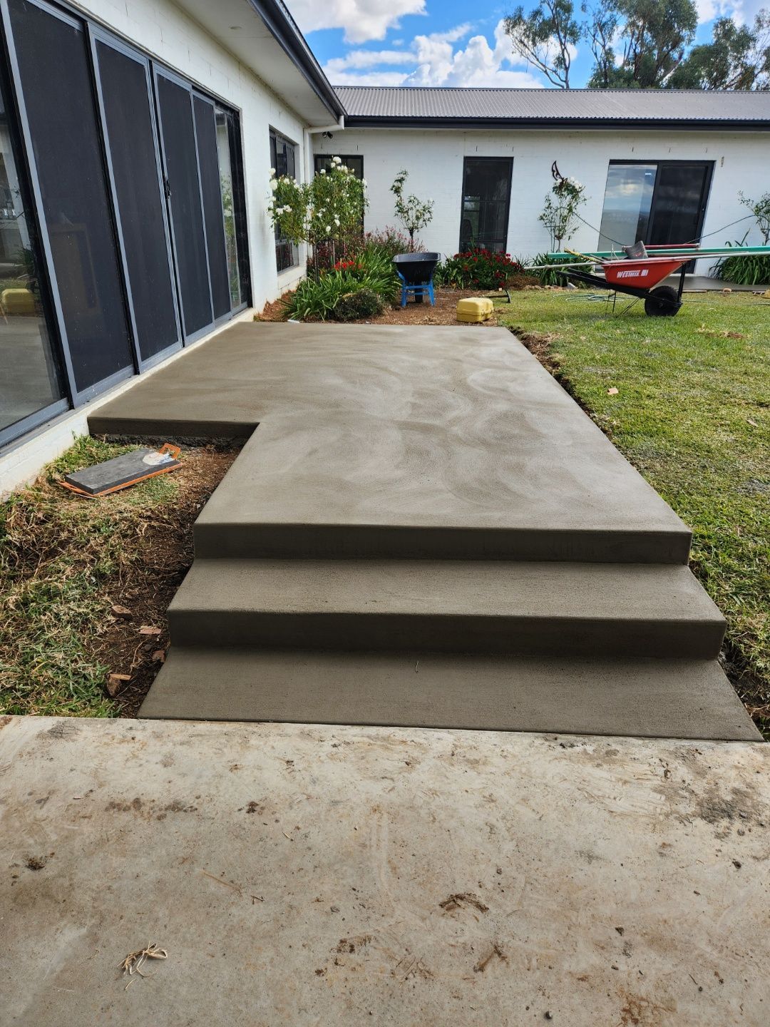 Construction Workers Laying Concrete Floor — Regional Concreting Solutions In Orange, NSW