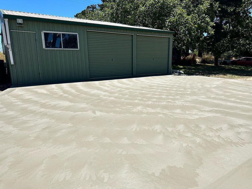 Concrete Driveway Near Shed — Regional Concreting Solutions In Orange, NSW