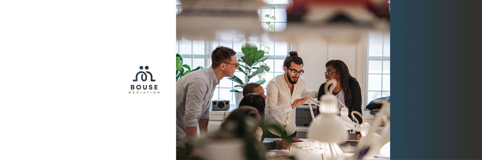 A group of people collaborating in a bright, modern office with plants in the background.