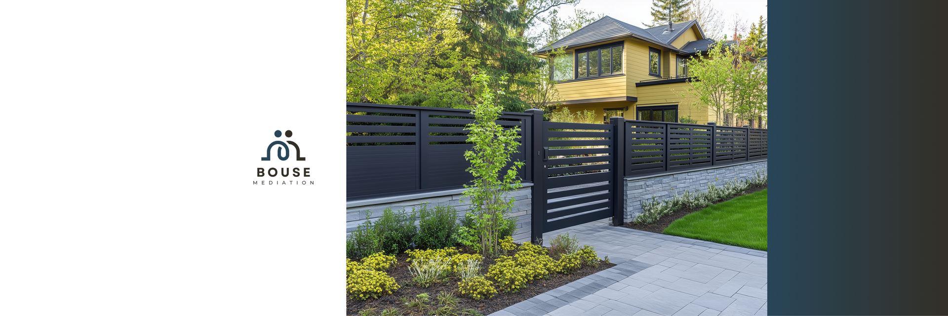 A modern home exterior with a black slatted fence, stone masonry base, and manicured landscaping.