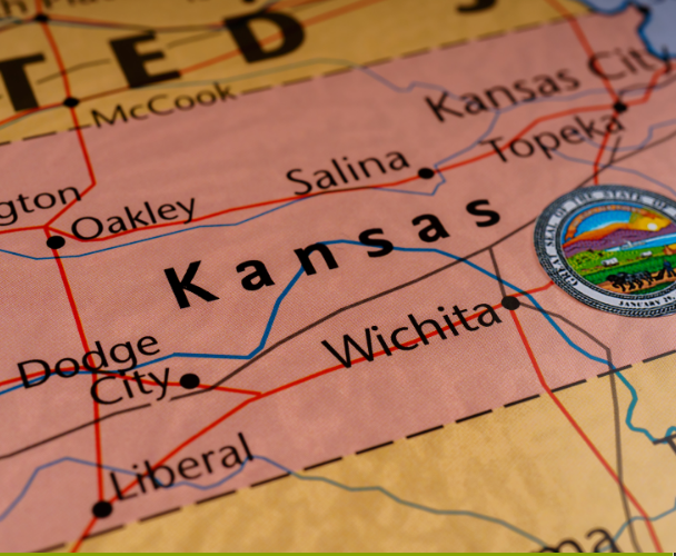 Close-up of a map of Kansas showing city locations and the state seal. Close-up of a map of Kansas showing city locations and the state seal.
