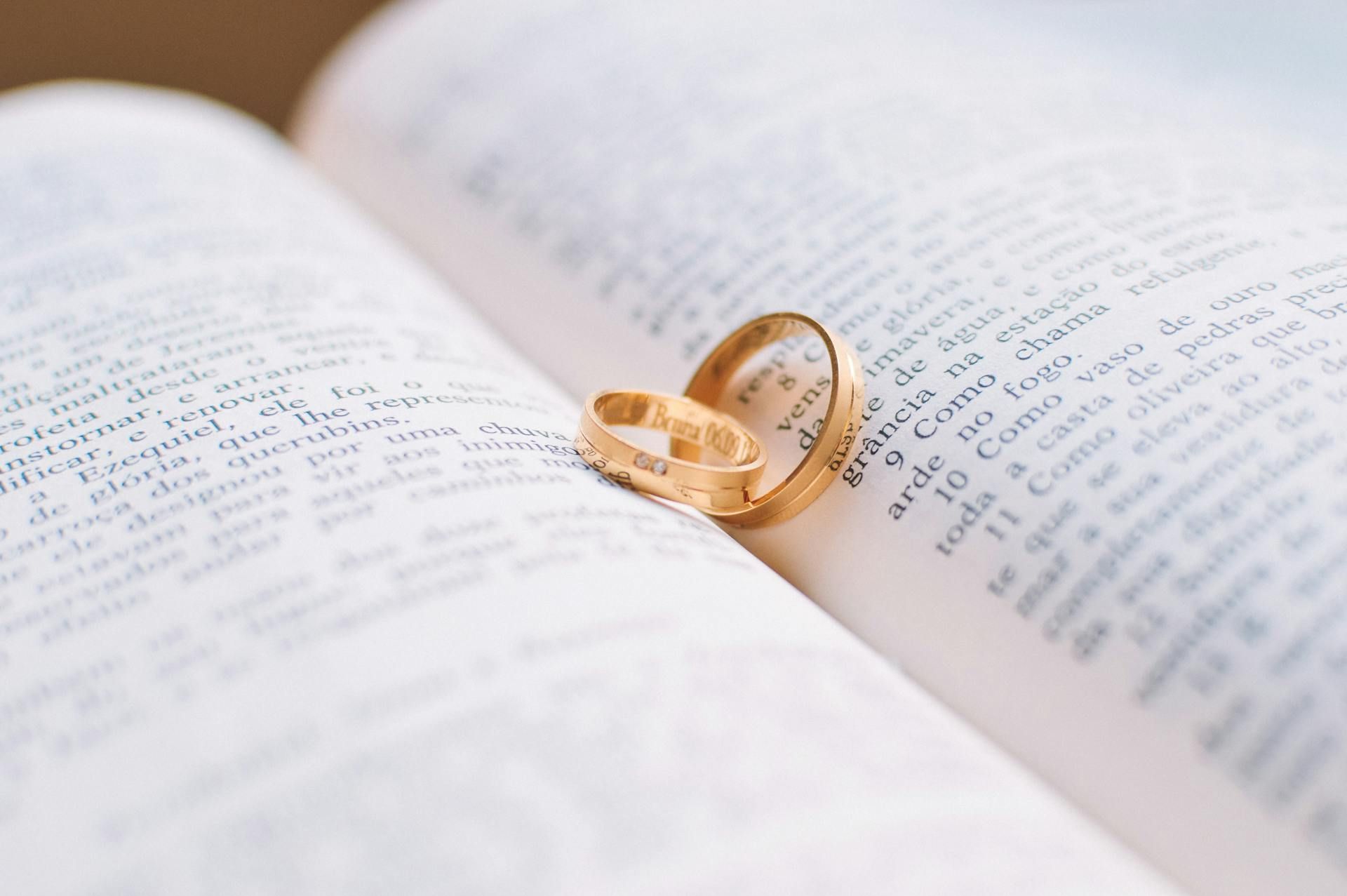 Wedding rings on a book